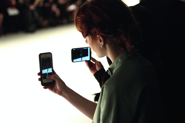 NEW YORK, NY - FEBRUARY 17: General atmosphere as guests take pictures with a phone at Georgine fashion show during Mercedes-Benz Fashion Week Fall 2015 at The Salon at Lincoln Center on February 17, 2015 in New York City. (Photo by Monica Schipper/Getty Images)